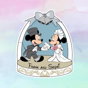 May include: A wedding-themed snow globe featuring Mickey and Minnie Mouse dressed in formal attire. The globe has a blue background and a white frame with the text "Frank and Sophi" at the bottom.