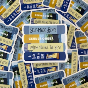May include: A stack of five colorful book-shaped stickers with the titles "Self-Made Boys", "Gender Queer", "I Wish You All The Best", "A Lady For A Duke", and "I Wish You All The Best".