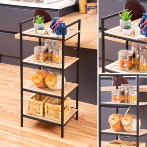 May include: A black metal shelf unit with four wooden shelves. The shelves are filled with various items, including jars of dried beans, baskets, and mugs. The shelf unit is standing on a wooden floor.