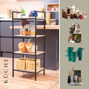May include: A black metal shelving unit with four shelves, filled with various glass jars and containers. The shelves are made of wood and the unit is standing on a wooden floor. The word "K&Uuml;CHE" is written in white on a black background in the lower left corner of the image.