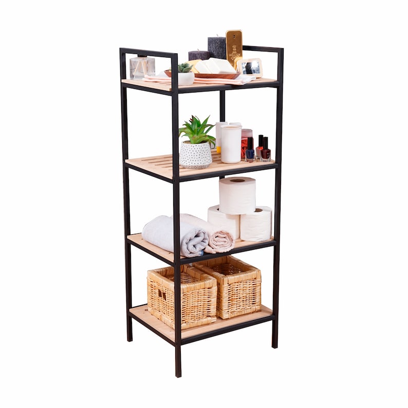 May include: A black metal bathroom shelf unit with four wooden shelves. The shelves are filled with various bathroom items, including a potted plant, towels, toilet paper, and baskets.