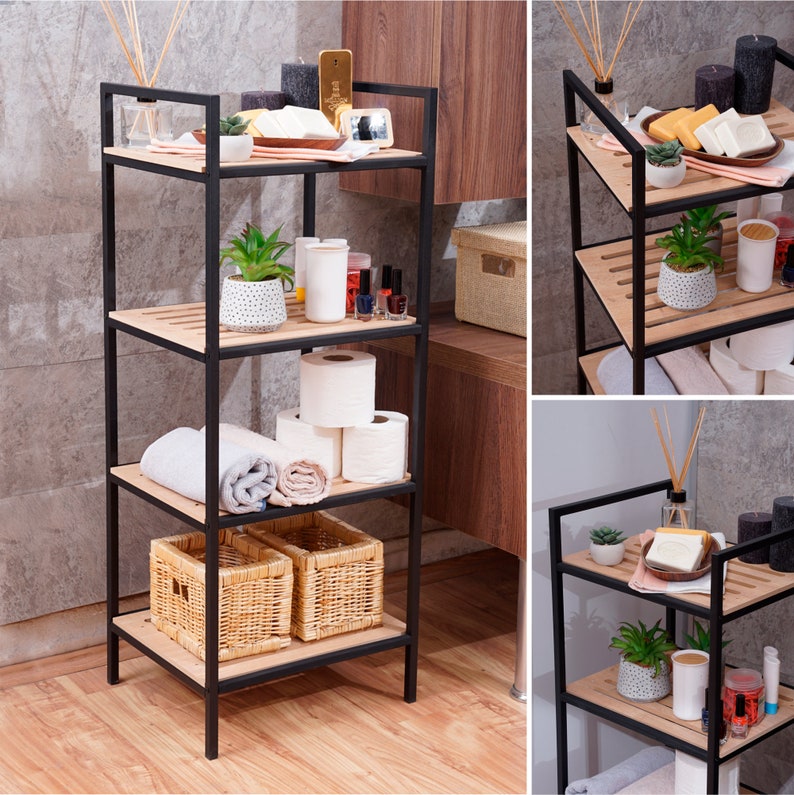 May include: A black metal shelf unit with four shelves. The shelves are made of wood and have a light brown finish. The shelf unit is filled with various items, including plants, toiletries, towels, and baskets.