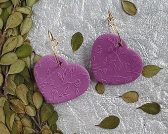 Julia Dangles purple. Handmade polymer clay earrings. Embossed floral design. Stylish earrings for any season. Cute heart shape.