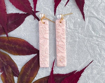 Amara Dangles light pink. Handmade polymer clay earrings. Lightweight earrings. Embossed rose design. Simple and elegant.