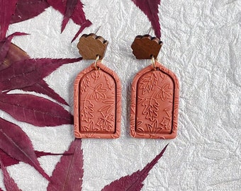 Autumn Dangles. Handmade polymer clay earrings. Unique arched shape. Terracotta color. Embossed autumn leaves. Scalloped topper.