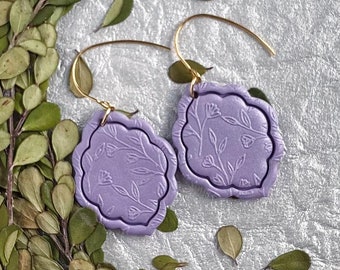 Christina Dangles purple. Handmade polymer clay earrings. Embossed floral design. Unique scalloped shape. Lightweight earrings.