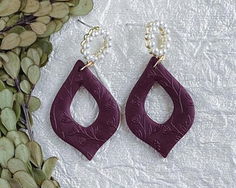 Rachel Dangles burgundy red. Handmade polymer clay earrings. Unique teardrop shape. Embossed texture. Earrings for a classy lady.