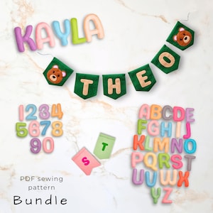 May include: A collection of colorful felt letters, numbers, and banners. The word "KAYLA" is spelled out in pastel letters. A banner spells "THEO" with bear accents. The image also includes numbers and the alphabet. The text "PDF sewing pattern Bundle" is at the bottom.