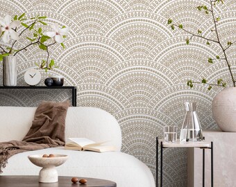 May include: A living room scene featuring a white sofa, a dark wood coffee table, and a side table. The wallpaper has a repeating fan-shaped pattern in white and gold. Decorative vases and a clock are also visible.