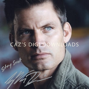 May include: A headshot of a man with short, dark hair and blue eyes. The man is wearing a green jacket. The image includes the text "CAZ'S DIGI DOWNLOADS" and a handwritten signature with the words "Stay Sweet".