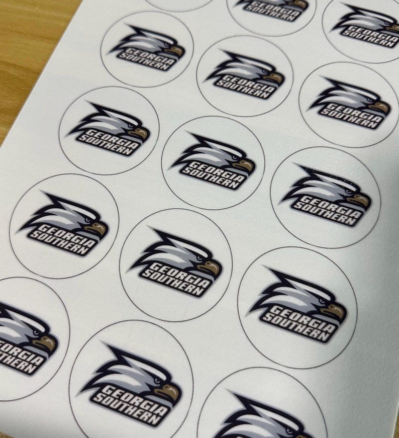 May include: A sheet of circular stickers featuring the Georgia Southern eagle logo. Each white sticker displays a stylized grey and white eagle head in profile facing right, with the text Georgia Southern printed in black beneath the eagle.