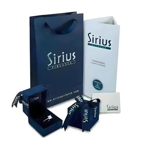 a blue shopping bag with a pair of scissors next to it