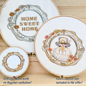 May include: Three embroidery hoops with different designs. The largest hoop features a gold and brown ornate frame with the text "HOME SWEET HOME". The middle hoop features a gold and brown ornate frame with a rooster wearing a top hat. The smallest hoop features a gold and brown ornate frame.