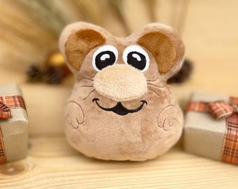 May include: A brown plush toy mouse with big eyes and a smiling mouth. The mouse has a brown nose and whiskers.