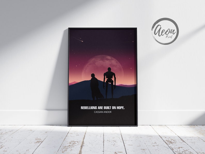 May include: A black and white silhouette of two figures standing in front of a large, red moon. The text "Rebellions are built on hope. Cassian Andor" is below the figures.