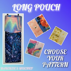 May include: Long pouch with a variety of fabric patterns to choose from. The pouch is made of a soft, plush fabric and is perfect for storing small items. Choose your pattern: rainbow, floral, yellow lemons, or pink and blue.
