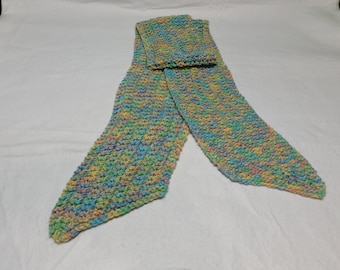 May include: A long, multi-colored knitted scarf with a speckled pattern in shades of blue, green, yellow, and pink.