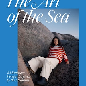 May include: A book cover with a blue border features the title "The Art of the Sea" in white script. The image shows a person wearing a red and white striped sweater and white pants. The text "23 Knitwear Designs Inspired by the Moomins" is also visible.