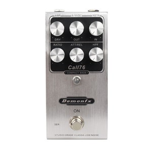 May include: A silver Demonfx Call76 compact bass compressor pedal with six knobs labelled "Dry", "Ratio", "Out", "Att/Rel", "In", and "HPF". The pedal has a black and silver design with the text "Call76" and "Compact Bass" printed on it. The pedal has a silver on/off switch and a silver "Ser" switch.