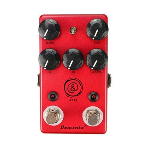 May include: Red Demonfx AT-03 overdrive guitar pedal with five knobs labeled "Volume", "Drive", "EQ", "Air", and "Boost". The pedal has two footswitches and a red LED light.