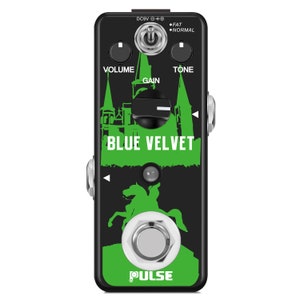 May include: A black and green guitar pedal with the text "BLUE VELVET" and the word "PULSE" in white. The pedal has three knobs labeled "VOLUME", "GAIN", and "TONE".