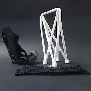 Transform your workspace with this incredible customizable DIY racing seat phone holder kit. It features an unassembled roll cage design that allows you to create a unique and stylish phone stand for your desk. Elevate your workspace today! Nine3D