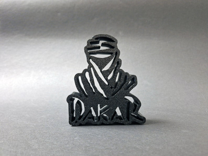 3D printed DAKAR logo stand in black, front perspective