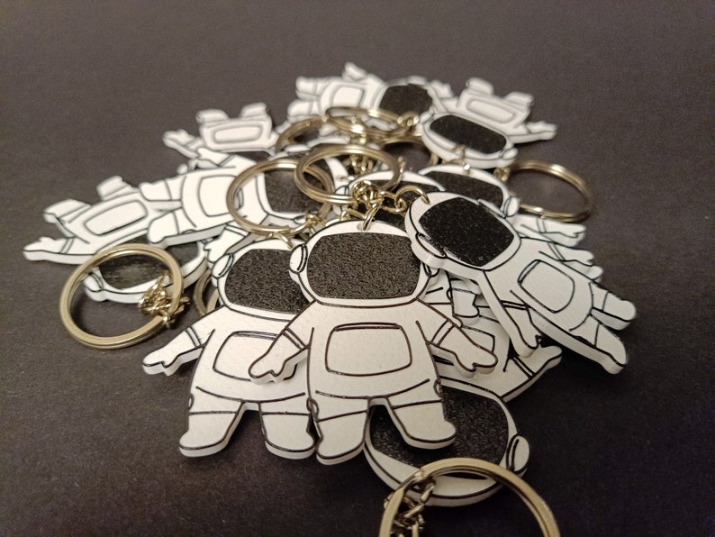 Explore our 3D printed spaceman astronaut keychain, a must-have accessory for space enthusiasts. Elevate your style with this unique cosmic gift. Ideal for gifting or personal use, it's a perfect blend of artistry and functionality. Shop Nine3D