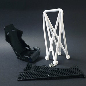 Transform your workspace with this incredible customizable DIY racing seat phone holder kit. It features an unassembled roll cage design that allows you to create a unique and stylish phone stand for your desk. Elevate your workspace today! Nine3D