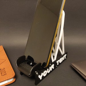 Discover the perfect blend of functionality and style with our racing seat phone holder. Ideal for motorsport enthusiasts, this 3D-printed accessory will change Your desk design and decor. Explore Nine3D shop's unique 3D-printed collection