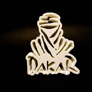 White 3D printed DAKAR logo stand