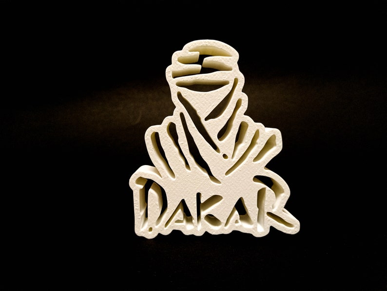 White 3D printed DAKAR logo stand