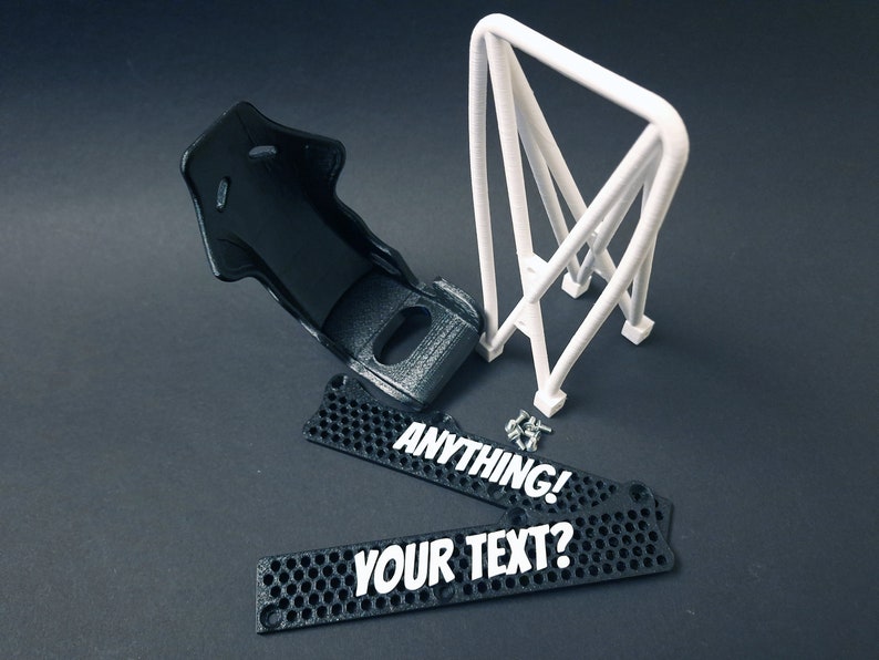 Transform your workspace with this incredible customizable DIY racing seat phone holder kit. It features an unassembled roll cage design that allows you to create a unique and stylish phone stand for your desk. Elevate your workspace today! Nine3D