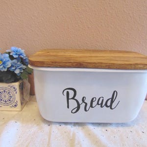 May include: A set of three ceramic mugs with a speckled, matte finish. The mugs are in shades of cream, light gray, and dark gray. Each mug has a simple, minimalist design, perfect for coffee or tea.