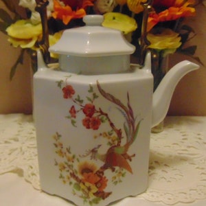 Beautiful Pre-Owned Olivia Kaiser West German Tea Pot with brass handle.