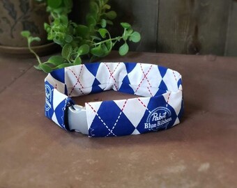 Pabst inspired collar wrap for your party animal! Protects collar from dirt. Machine washable. Easily slip over existing collar. Ruffle free