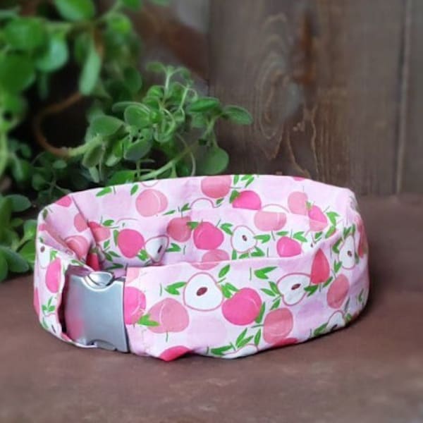 Peach print slip on collar cover. Protects collar from dirt. Machine washable. Easily slips over your existing collar. No ruffle collar wrap