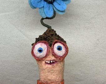 Worm with Blue Flower