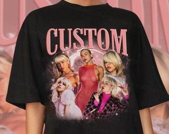 May include: Black t-shirt with a pink "CUSTOM" graphic featuring a collage of five women with blonde hair. The women are wearing various outfits, including a pink dress, a plaid jacket, and a white dress.
