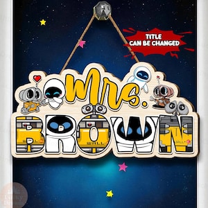 May include: Wooden sign with the name "Mrs. Brown" in yellow script and block letters, featuring cartoon characters. The sign is decorated with stars and a red speech bubble that says "TITLE CAN BE CHANGED".