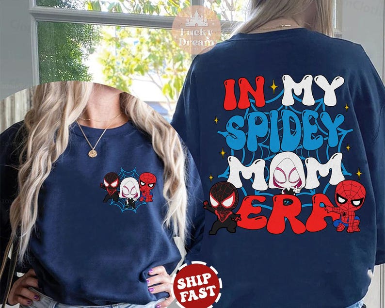 May include: A navy blue sweatshirt with the text "In My Spidey Mom Era" in white, red, and blue. The text is surrounded by a web design. There are four cartoon spider-people in the bottom of the design.