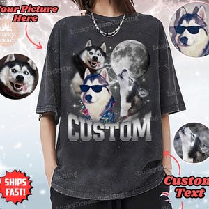 May include: A black t-shirt with a distressed look featuring a custom text design that says "CUSTOM". The design includes three husky dogs, one wearing sunglasses, and a full moon.