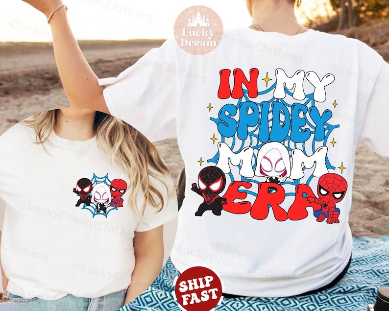 May include: Two white t-shirts with a graphic design featuring a spider-man theme. The design includes the text "In My Spidey Mom Era" with cartoon images of Spider-Man characters.