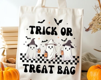 May include: A white canvas tote bag with black handles and a Halloween design. The bag features three ghosts holding cups, with the text "Trick or Treat Bag" printed in black.