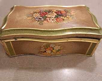 Vintage metal box with beautiful bright colors and vintage floral patterns in perfect condition.