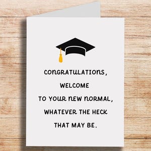 May include: A graduation card with a black graduation cap and the text "Congratulations, Welcome to your new normal, whatever the heck that may be."
