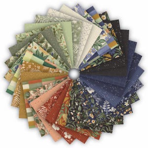May include: A fan of fabric swatches in a variety of colours and patterns. The swatches feature floral, geometric, and solid designs in shades of green, blue, orange, and brown. A silver ball is in the centre.