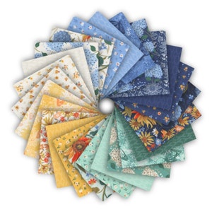 May include: A collection of 24 fabric squares featuring floral patterns in shades of blue, yellow, and green. The squares are arranged in a circle, with the centre of the circle being a white background.