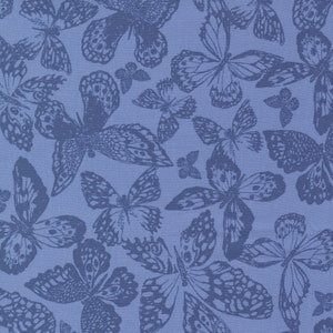 May include: A blue fabric with a repeating pattern of dark blue butterflies. The butterflies are stylised and have intricate details.