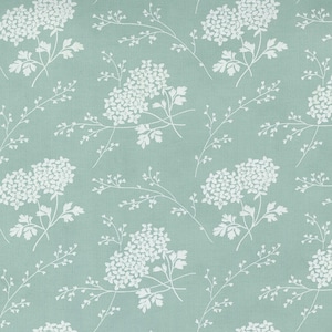 May include: A repeating pattern of white floral clusters and sprigs on a soft teal background. The botanical design creates a fresh, airy aesthetic. The fabric has a subtle texture, with the white flowers and sprigs contrasting against the teal.